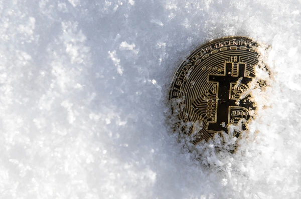 bitcoin-cryptocurrency-on-snow-background-600nw-1038215032